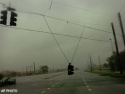Fri., Aug. 13: Rain and wind whips across U.S. Route 41 leading into Port Charlotte, Fla., as Hurricane Charley shakes loose traffic lights, power lines and homes