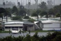 A trailer park is damaged by Hurricane Charley in Port Charlotte, Florida after Charley hit the west coast of Florida on August 13, 2004. Charley, a category 4 storm packing 145 mph winds, (233 kph), continues to move inland across the Florida peninsula. REUTERS/Marc Serota 