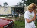 Fri., Aug. 13: Candace Gott reacts to loss of her mobile home from Hurricane Charley in North Fort Myers, Fla. \"We lost everything\" she said.
